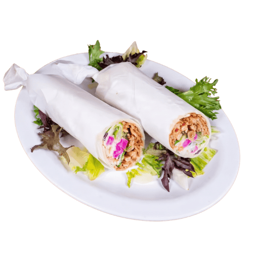 Rolled Mediterranean wrap wrapped with fresh lettuce and savory meats